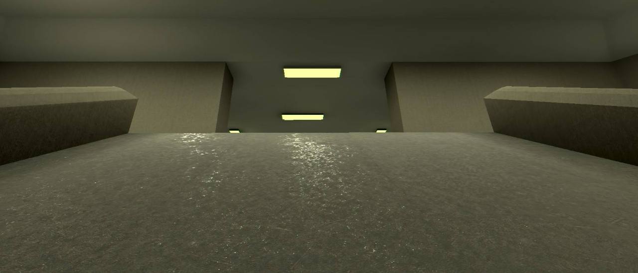 A stark concrete facility lit by yellow ceiling lights